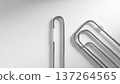 Silver Paper Clips on White Background. 137264565