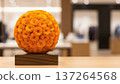 Orange Floral Arrangement on Wooden Stand. 137264568