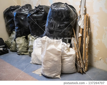 pile of bags with construction waste in room pile of bags with construction waste in room 137264707