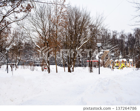 view of playground in snowy city park in winter view of playground in snowy city park in winter 137264786