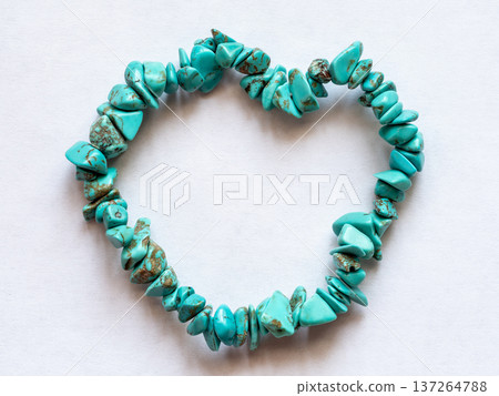 stone bracelet into heart shape on white paper stone bracelet into heart shape on white paper 137264788