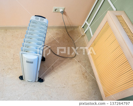 top view of oil heater and heating radiator top view of oil heater and heating radiator 137264797