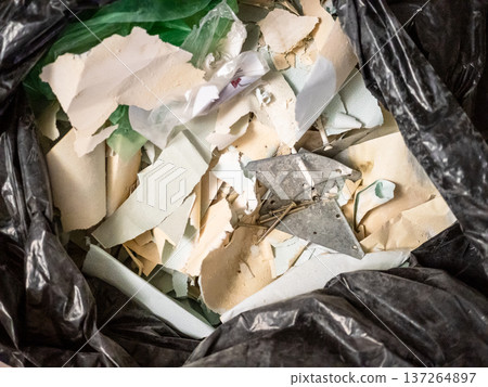 above view of scraps of peeling wallpaper closeup above view of scraps of peeling wallpaper closeup 137264897