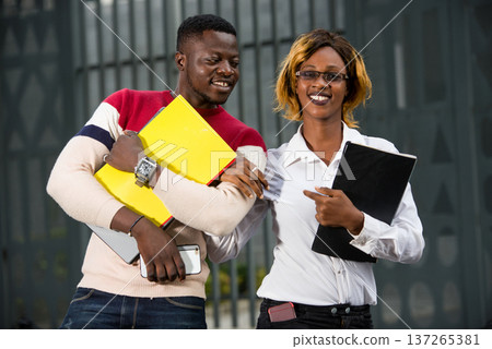 Group of happy students outdoors Group of happy students outdoors 137265381