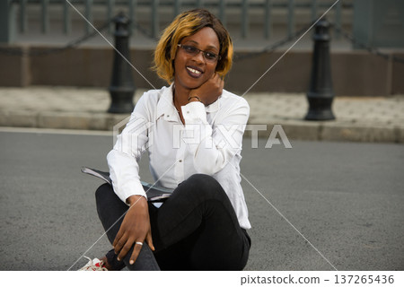 smiling girl outdoors at university. smiling girl outdoors at university. 137265436