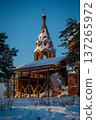 Ancient Bell Tower in Snowy Winter Landscape 137265972