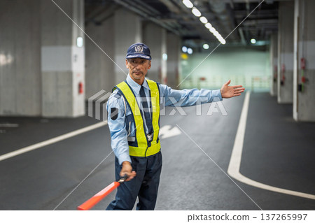 Security guard, traffic control officer, senior man Security guard, traffic control officer, senior man 137265997