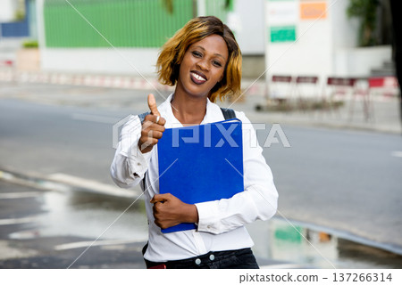 Portrait of smiling university student standing outside on the road to class 137266314