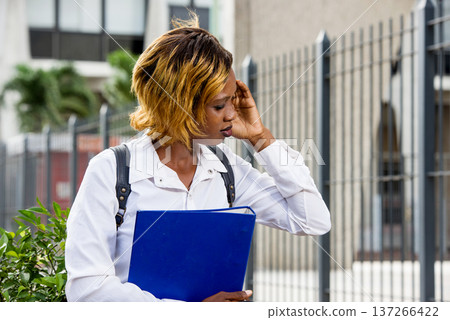 student having headache outside student having headache outside 137266422