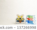 A May doll decoration of a helmet and carp streamers placed on washi paper 137266998