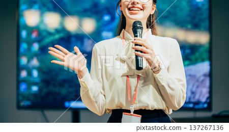 A woman giving a presentation 137267136