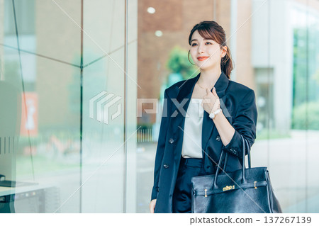 Young woman in a suit 137267139