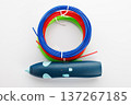 3D Printing Pen with Colorful Filament on White Background 137267185