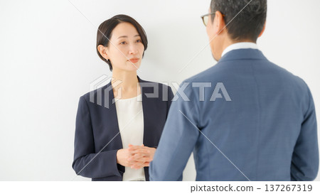Men and women having a business conversation Men and women having a business conversation 137267319
