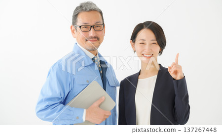 Men and women in work clothes Men and women in work clothes 137267448