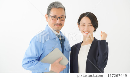 Men and women in work clothes Men and women in work clothes 137267449