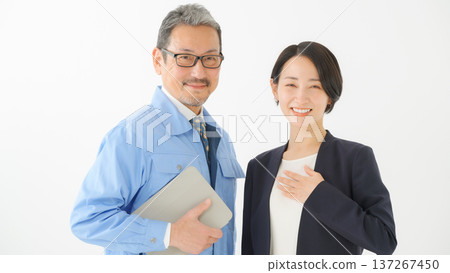 Men and women in work clothes Men and women in work clothes 137267450