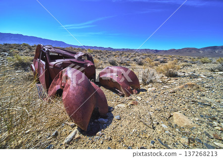 Rusted Abandoned Car In California Desert With White Mountain Range Scenery 137268213