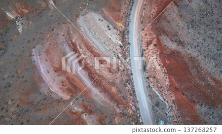 Aerial Top Down Winding Road and Red Desert Formations at Sunrise Near Las Vegas Nevada Aerial Top Down Winding Road and Red Desert Formations at Sunrise Near Las Vegas Nevada 137268257