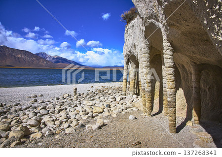 Crowley Lake Stone Columns and Sierra Nevada Mountains Beside Blue Water in Sunlight Crowley Lake Stone Columns and Sierra Nevada Mountains Beside Blue Water in Sunlight 137268341