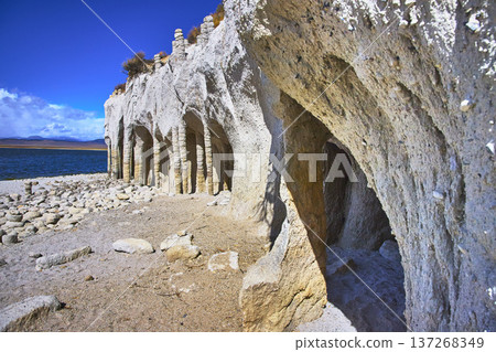 Crowley Lake Stone Columns and Rocky Shoreline with Blue Water in Bright Sunlight Crowley Lake Stone Columns and Rocky Shoreline with Blue Water in Bright Sunlight 137268349