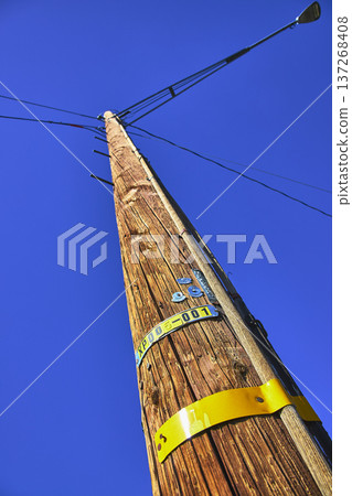 Telephone Pole and Utility Wires Against Clear Blue Sky California Perspective 137268408