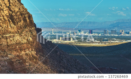 Red Rock Canyon Cliff and Las Vegas Strip Skyline with Expansive Desert View Red Rock Canyon Cliff and Las Vegas Strip Skyline with Expansive Desert View 137268469