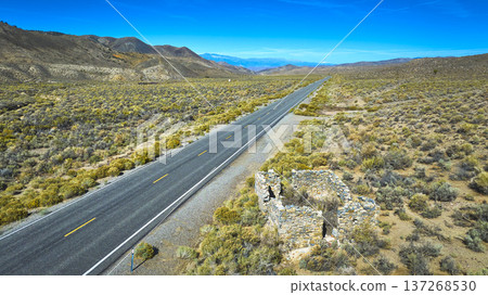 Aerial Desert Highway Ruins and Mountains in Remote California Landscape Aerial Desert Highway Ruins and Mountains in Remote California Landscape 137268530