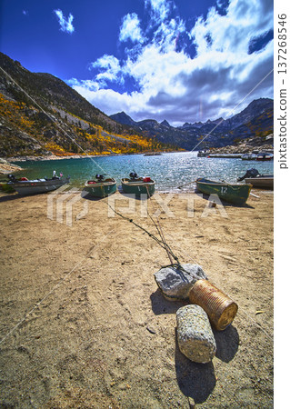 Mountain Lake Boats and Sandy Shore with Fall Colors and Dramatic Sky Mountain Lake Boats and Sandy Shore with Fall Colors and Dramatic Sky 137268546