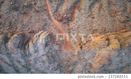 Aerial Rugged Rock Formations and Desert Trail Top Down 137268551