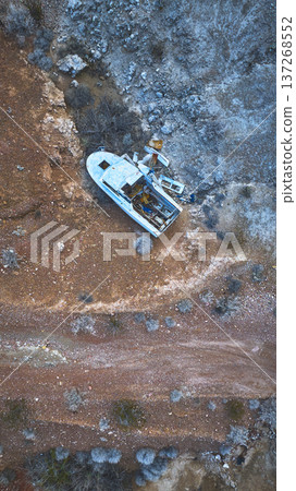 Aerial Abandoned Boat on Desert Terrain Near Lava Butte Nevada Top Down Aerial Abandoned Boat on Desert Terrain Near Lava Butte Nevada Top Down 137268552