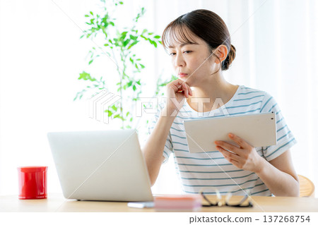 Middle-aged women working remotely 137268754