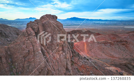 Aerial Lava Butte Red Desert Terrain and Distant Las Vegas Cityscape 137268835