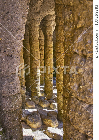 Crowley Lake Stone Columns Natural Rock Formations and Sunlit Passage California 137268893