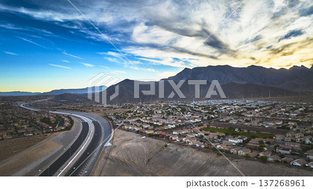 Aerial Las Vegas Residential Neighborhood and Spring Mountain Range at Sunset 137268961