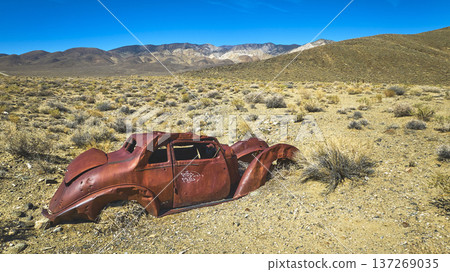 Abandoned Rust Car in California Desert with White Mountain Backdrop Abandoned Rust Car in California Desert with White Mountain Backdrop 137269035