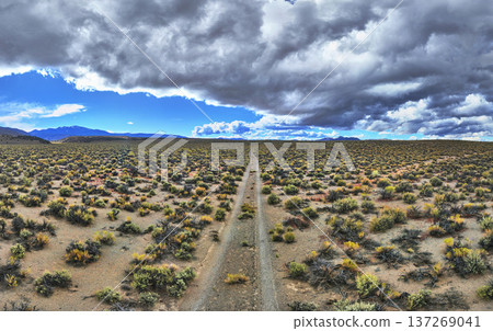 Aerial Panorama California Desert Road and Dramatic Sky Over River Spring Lakes 137269041