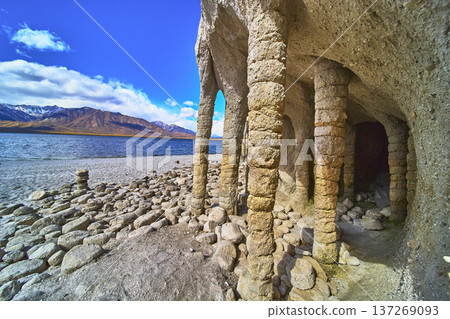 Crowley Lake Stone Columns and Sierra Nevada Mountains Beside Blue California Lake 137269093