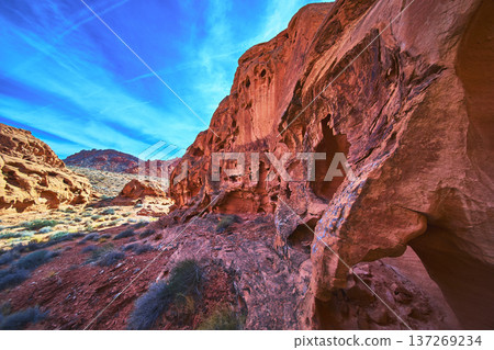 Red Sandstone Formations and Desert Landscape Under Vibrant Blue Sky 137269234