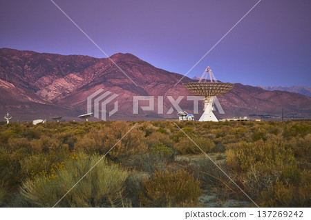 Radio Telescope Array and Observatory at Dusk with Mountains in Owens Valley California Radio Telescope Array and Observatory at Dusk with Mountains in Owens Valley California 137269242
