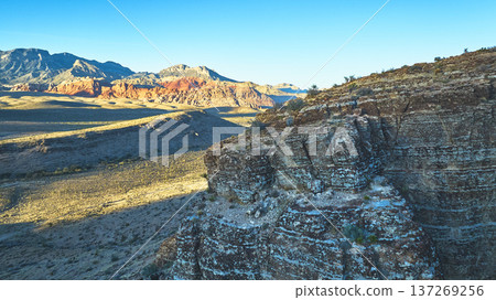 Aerial Cowboy Canyon Rock Formations and Mountain Landscape at Golden Hour Aerial Cowboy Canyon Rock Formations and Mountain Landscape at Golden Hour 137269256