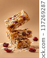 Macro Photo of Stacked Breakfast Energy Bars with Oats and Cranberries 137269287