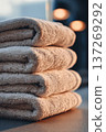 Neatly Stacked Fresh Towels in Soft Morning Light for Spa Ambiance 137269292