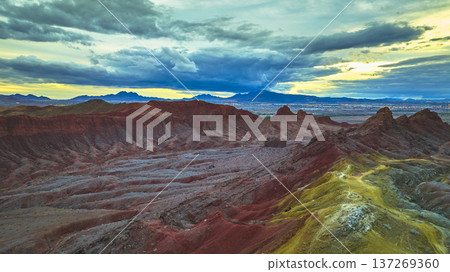 Aerial Lava Butte Rugged Red Rock Formations and Las Vegas Skyline at Sunset 137269360
