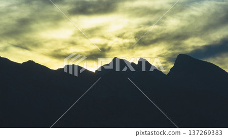Spring Mountain Silhouette at Sunrise with Dramatic Sky and Cloud Patterns Spring Mountain Silhouette at Sunrise with Dramatic Sky and Cloud Patterns 137269383