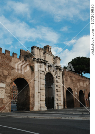 Archbasilica of Saint John Lateran facade and Lateran district with piazza palace and Porta San Giovanni ancient walls Rome Italy exterior architecture landmark. High quality photo Archbasilica of Saint John Lateran facade and Lateran district with piazza palace and Porta San Giovanni ancient walls Rome Italy exterior architecture landmark. High quality photo 137269986