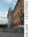Archbasilica of Saint John Lateran facade and Lateran district with piazza palace and Porta San Giovanni ancient walls Rome Italy exterior architecture landmark. High quality photo 137270002