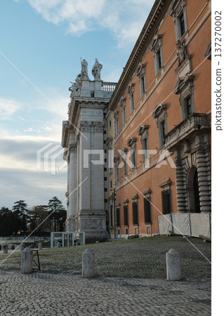 Archbasilica of Saint John Lateran facade and Lateran district with piazza palace and Porta San Giovanni ancient walls Rome Italy exterior architecture landmark. High quality photo 137270002