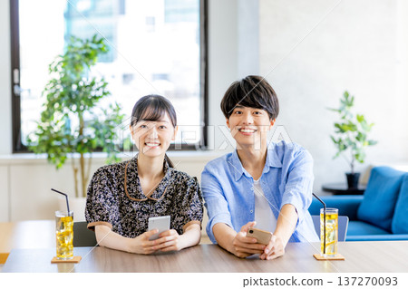 A man and a woman in a cafe A man and a woman in a cafe 137270093