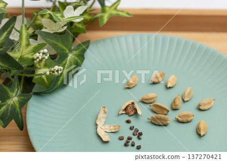 Cardamom seeds - spice stock photo - Cardamom is said to be good for preventing hay fever Cardamom seeds - spice stock photo - Cardamom is said to be good for preventing hay fever 137270421